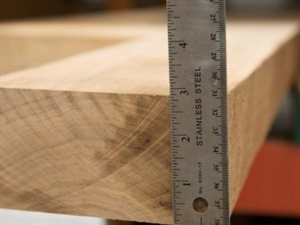 12/4 lumber with ruler showing the thickness